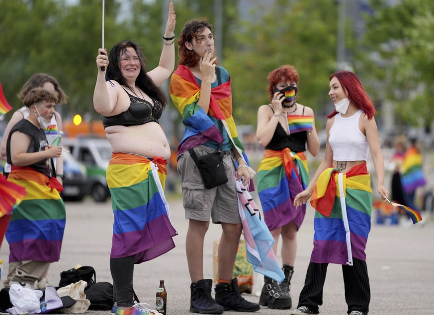 Football supporters are seen with LGBT pride flags outside of the stadium before the Euro 2020 soccer championship group F match between Germany and Hungary at the Allianz Arena in Munich, Germany,Wed ...