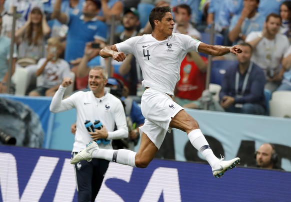 France&#039;s Raphael Varane, right, celebrates after scoring his side&#039;s opening goal during the quarterfinal match between Uruguay and France at the 2018 soccer World Cup in the Nizhny Novgorod  ...