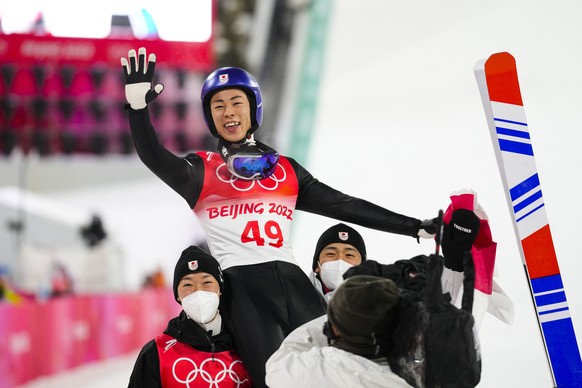 Ryoyu Kobayashi, of Japan, celebrates after winning gold during the men&#039;s normal hill individual ski jumping event at the 2022 Winter Olympics, Sunday, Feb. 6, 2022, in Zhangjiakou, China. (AP Ph ...