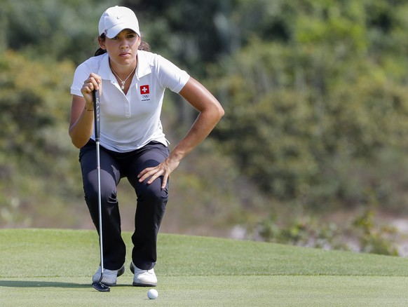 epa05499637 Albane Valenzuela of Switzerland lines up her putt on the fourth green during the third round of the Rio 2016 Olympic Games women&#039;s golf tournament at the Olympic Golf Course in Barra ...