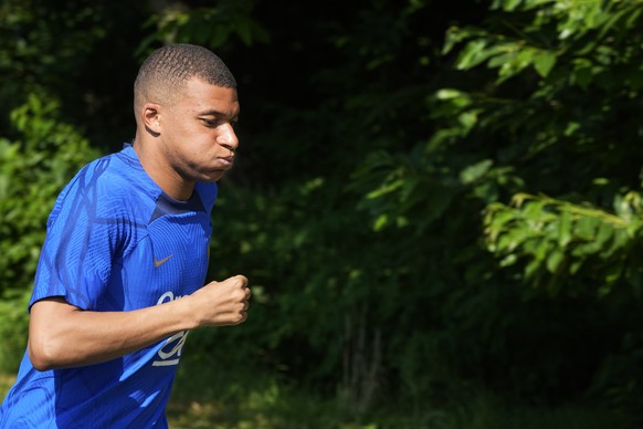French soccer player Kylian Mbappe arrives for a training session with the French national team at the national soccer team training ground in Clairefontaine, west of Paris, Tuesday, June 13, 2023. Th ...