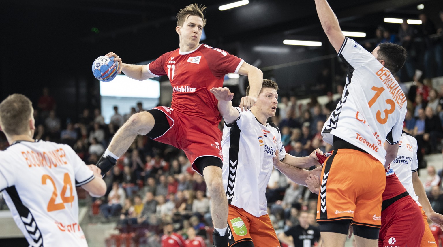 Switzerland&#039;s Roman Sidorowicz, left, in action against Netherlands&#039; Samir Benghanem, right, during the Yellow Cup Handball game between Switzerland and Netherlands in Switzerland, Winterthu ...