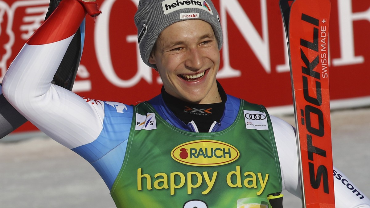 From left, second placed Norway's Rasmus Windingstad, the winner, Norway's Henrik Kristoffersen and third placed Switzerland's Marco Odermatt celebrate in the finish area after an Alpin ...