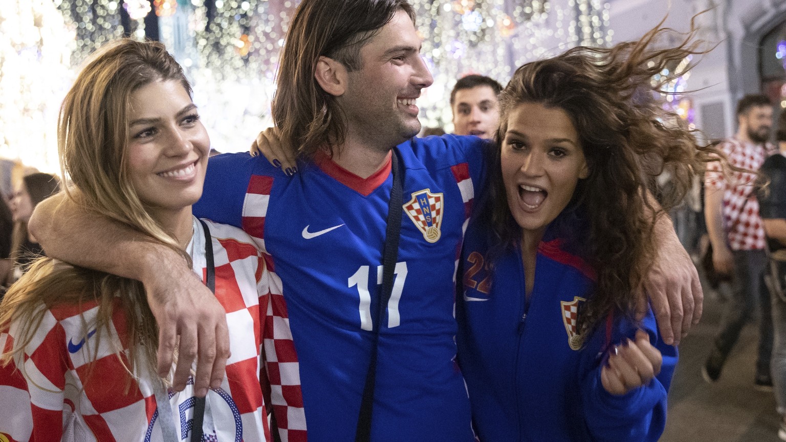 Croatia&#039;s soccer fans celebrate in Nikolskaya street near the Kremlin as their team won the semifinal soccer match between Croatia and England during the 2018 soccer World Cup at the Luzhniki sta ...