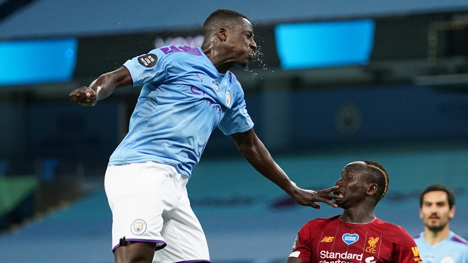 epa08523926 Manchester City&#039;s Benjamin Mendy (L) in action against Liverpool&#039;s Sadio Mane (R) during the English Premier League match between Manchester City and Liverpool in Manchester, Bri ...