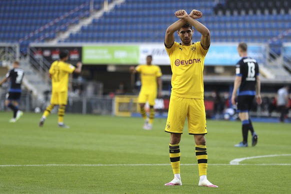 Achraf Hakimi Mouh of Borussia Dortmund celebrates scoring his teams fourth goal of the game during the German Bundesliga soccer match between SC Paderborn 07 and Borussia Dortmund at Benteler Arena i ...