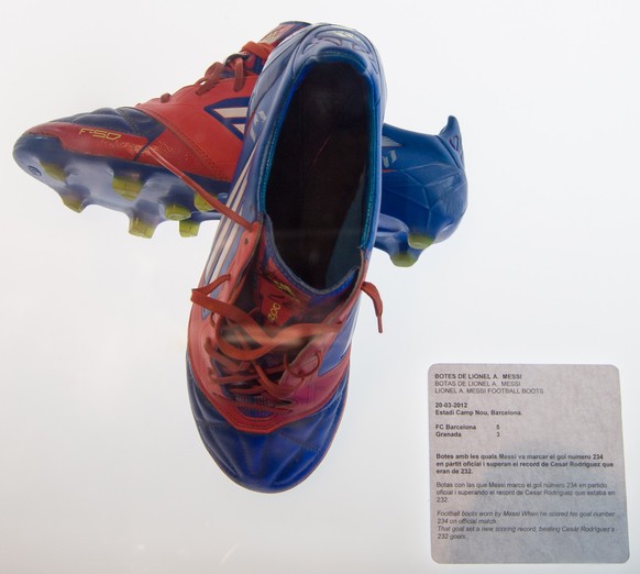 Barcelona, Spain - September 22, 2014: Lionel Messi football boots at the FC Barcelona museum. He scored his goal number 234 on official match. Camp Nou, Barcelona, Spain. xkwx messi, shoe, boots, foo ...