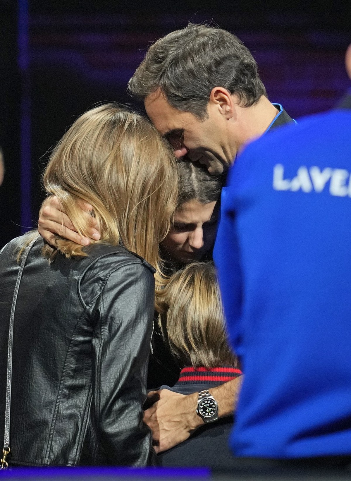 An emotional Roger Federer of Team Europe embraces his wife Mirka and their children after playing with Rafael Nadal in a Laver Cup doubles match against Team World's Jack Sock and Frances Tiafoe ...