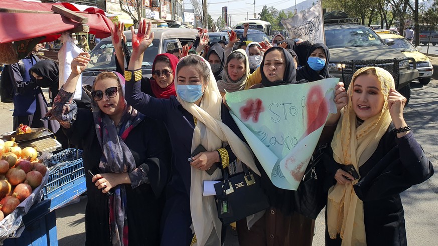 Afghan girls chant slogans during a protest they call &quot;Stop Hazara genocide&quot; a day after a suicide bomber attack in a Hazara education center, in Kabul, Afghanistan, Saturday, Oct. 1, 2022.  ...