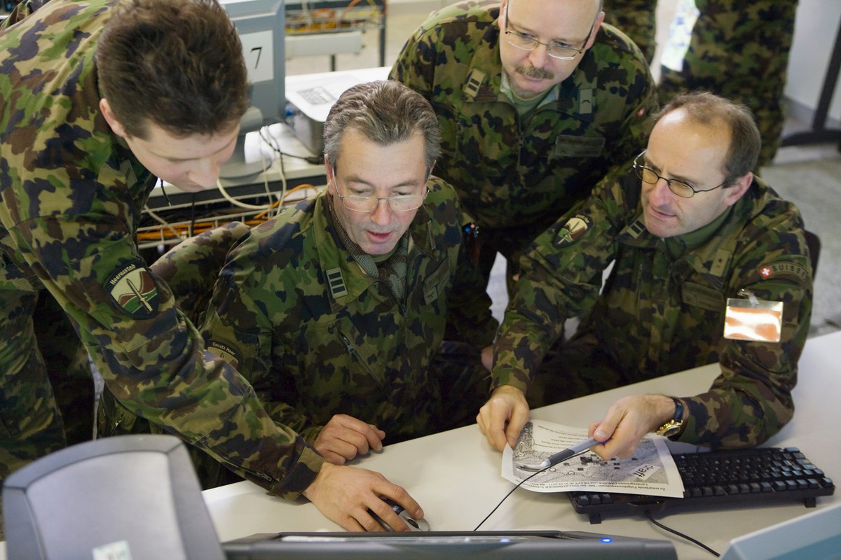 Swiss army officers work on the computer-based leadership information system (FIS) during the "STABILO 08" exercise in a bunker in Berne, Switzerland, pictured on August 19, 2008. Apart from ...