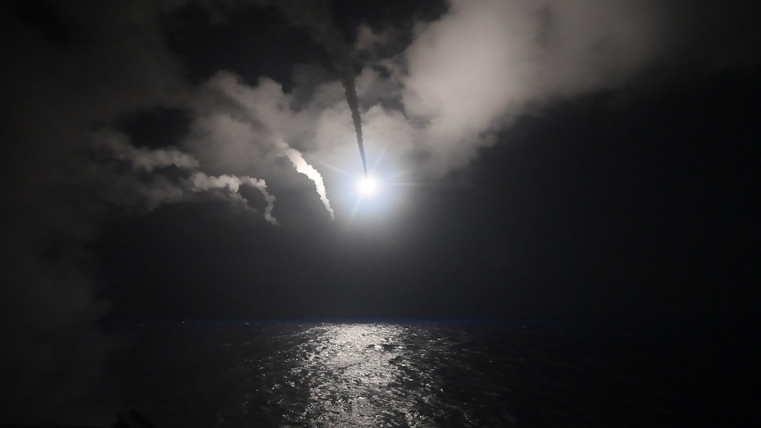 epa05893612 A handout photo made available by the US Navy Office of Information shows the guided-missile destroyer USS Porter (DDG 78) conducting strike operations while in the Mediterranean Sea, 07 A ...