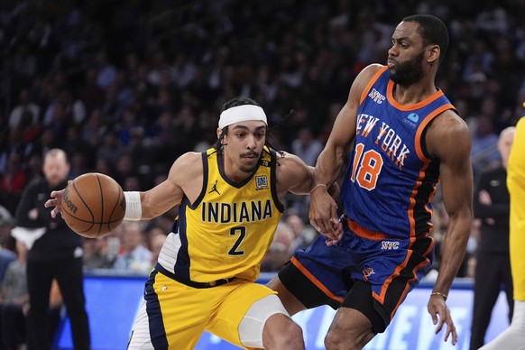 Indiana Pacers&#039; Andrew Nembhard (2) drives past New York Knicks&#039; Alec Burks (18) during the first half of Game 5 in an NBA basketball second-round playoff series, Tuesday, May 14, 2024, in N ...