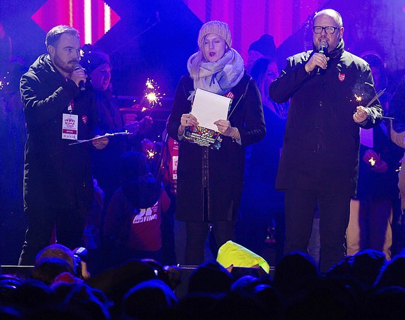 Gdansk Mayor Pawel Adamowicz,right, far right, speaks to an audience shortly before he was stabbed in Gdansk, Poland, on Sunday Jan. 13, 2019. Adamowicz was taken to a hospital in very serious conditi ...