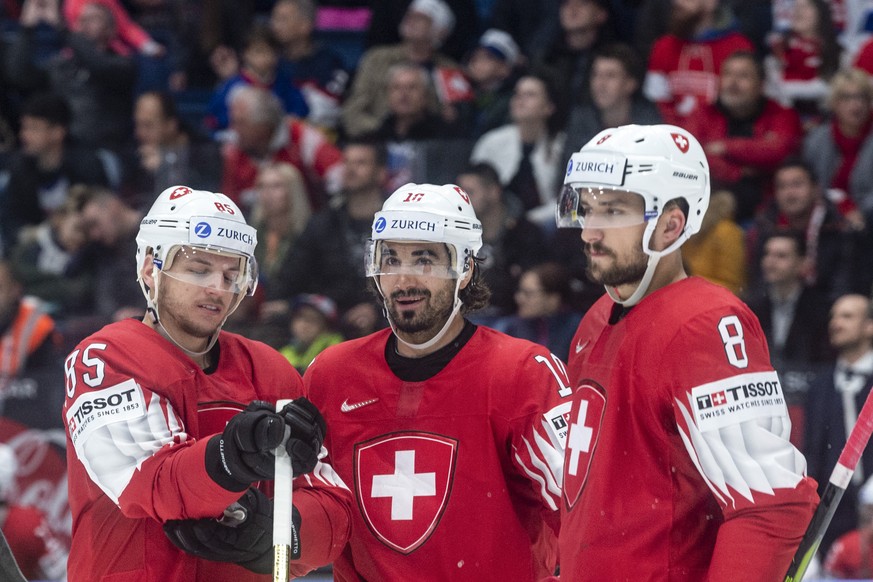 Switzerland`s Sven Andrighetto, Switzerland&#039;s Andres Ambuehl and Switzerland&#039;s Vincent Praplan during the game between Switzerland and Norway, at the IIHF 2019 World Ice Hockey Championships ...