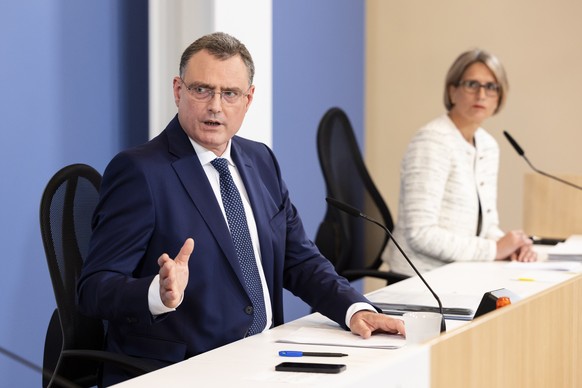 epa10705572 Swiss National Bank (SNB) Governing Board Chairman Thomas Jordan (L) gestures next to Member of the Governing Board Andrea Maechler during a media briefing at the SNB headquarters in Zuric ...