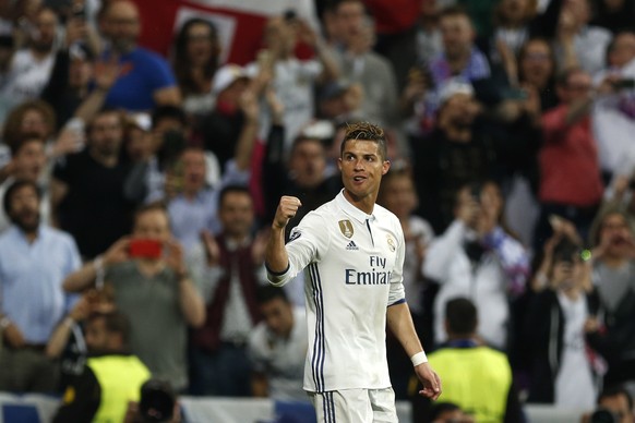 Real Madrid&#039;s Cristiano Ronaldo celebrates scoring his side&#039;s 2nd goal during the Champions League semifinal first leg soccer match between Real Madrid and Atletico Madrid at the Santiago Be ...