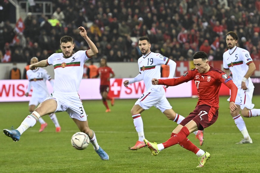 Switzerland's midfielder Ruben Vargas, right, scores the second goal in front of Bulgaria's defender Andrea Hristov, left, during the 2022 FIFA World Cup European Qualifying Group C match be ...