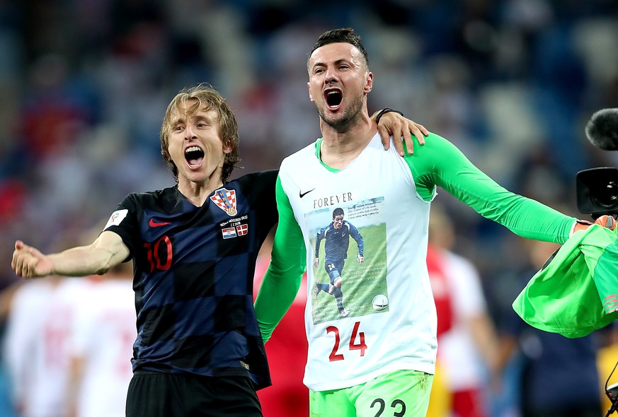 epa06856788 Goalkeeper Danijel Subasic of Croatia (R) and Luka Modric of Croatia celebrate winning the FIFA World Cup 2018 round of 16 soccer match between Croatia and Denmark in Nizhny Novgorod, Russ ...