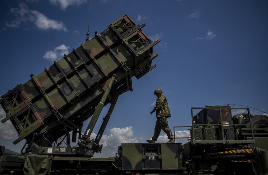 epa09937880 A German soldier walks during presentation of how it works at the launching station of NATO&#039;s Patriot missile air defense system operated by German army unit Flugabwehrraketengruppe 2 ...