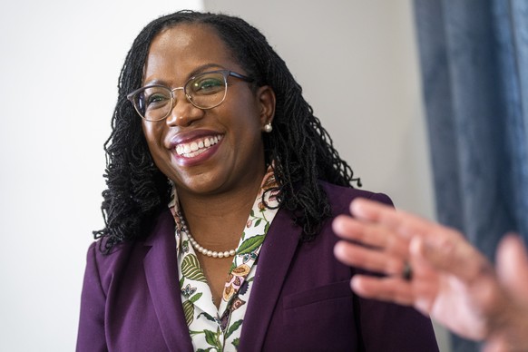 epa09870648 Supreme Court nominee Judge Ketanji Brown Jackson meets with Democratic Senator from Virginia Mark Warner during a break in the Senate Judiciary committee&#039;s business meeting to vote o ...