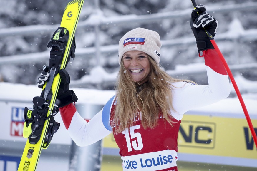 Switzerland&#039;s Corinne Suter celebrates on the podium following her second-place finish in the women&#039;s World Cup downhill ski race at Lake Louise, Alberta, Friday, Dec. 6, 2019. (Jeff McIntos ...