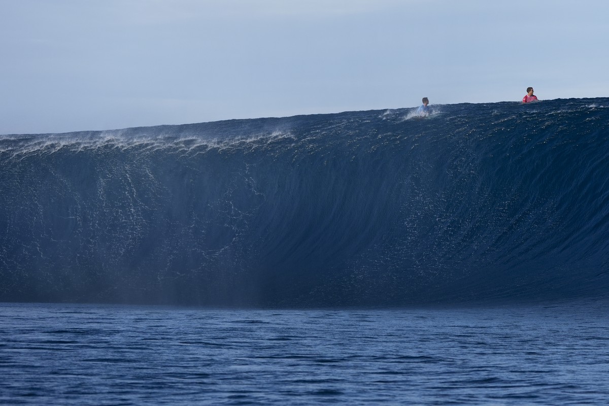 Griffin Colapinto, of the United States, right, and Kauli Vaast, of France, go over the top of a wave during the third round of surfing competition at the 2024 Summer Olympics, Monday, July 29, 2024,  ...