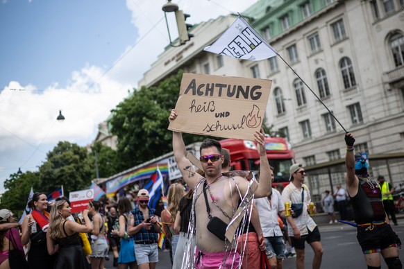 epa10696579 Participants attend the Rainbow Parade in Vienna, Austria, 17 June 2023. The Rainbow Parade, a rally against the discrimination of lesbian, gay, bisexual, transgender, intersex, queer/ques ...