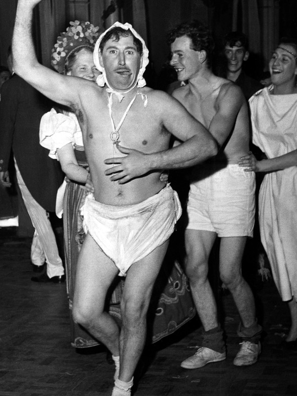 A man dressed as a baby with nappy, dummy and cap at the Chelsea Arts Ball. 2nd January 1954. (Photo by Hope/Daily Mirror/Mirrorpix via Getty Images)