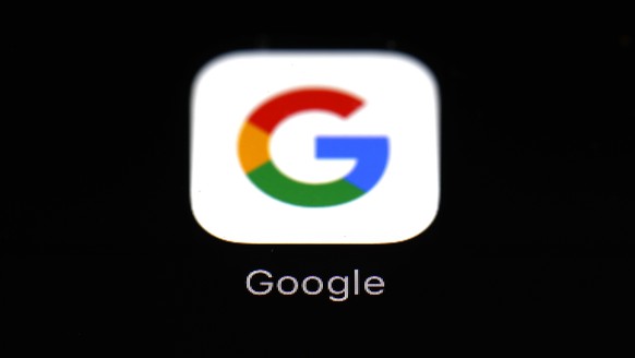 FILE - This March 19, 2018, file photo shows the Google app on an iPad in Baltimore. Google will give away $25 million to projects that propose ways to use the artificial intelligence of computers to  ...