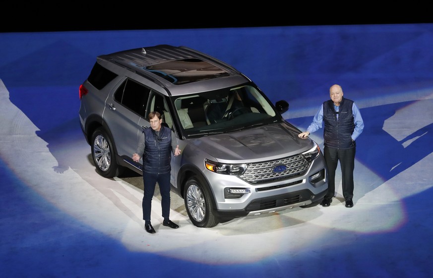 Ford Motor Co., President, Global Markets Jim Farley, left, and President and CEO Jim Hackett stand next to the redesigned 2020 Ford Explorer during its unveiling, Wednesday, Jan. 9, 2019, in Detroit. ...