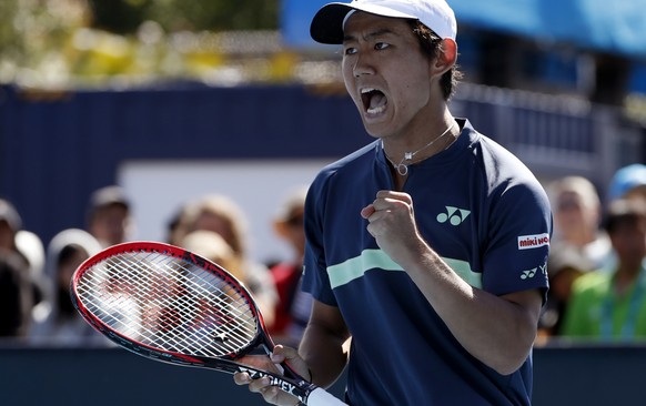 Japan&#039;s Yoshihito Nishioka celebrates a point win over Germany&#039;s Philipp Kohlschreiber during their first round match at the Australian Open tennis championships in Melbourne, Australia, Mon ...