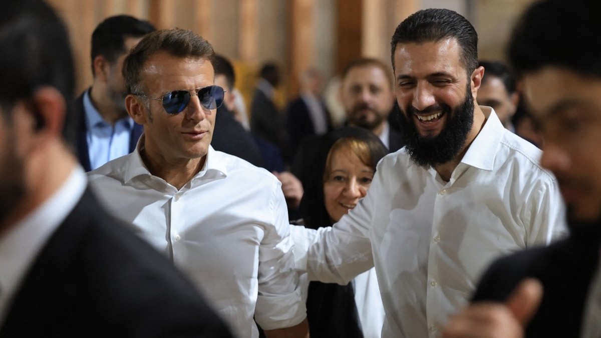 France's President Emmanuel Macron (L) and Syrian President Ahmed Al-Charaa visit the Umayyad Mosque in Damascus, on July 6, 2026. French President Emmanuel Macron arrived in Damascus on July 6,  ...