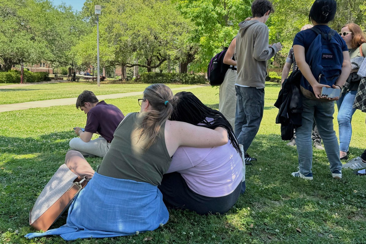 People comfort each other on Florida State University?s campus in Tallahassee, where law enforcement responded to a reported active shooter incident Thursday, April 17, 2025. (AP Photo/Kate Payne)
Flo ...