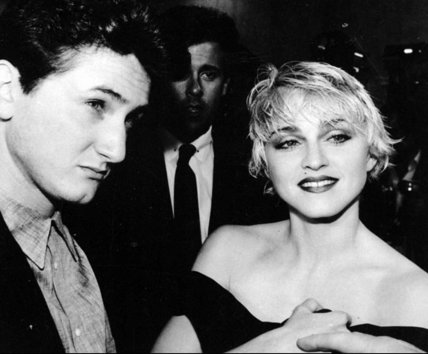 In this April 17, 1986 photo, Sean Penn and his wife, singer Madonna chat with reporters prior to the screening of Penn&#039;s new movie &quot;At Close Range&quot; in Los Angeles. (AP photo/Craig Math ...