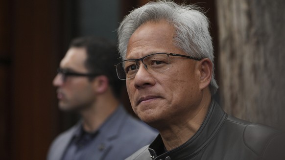 CEO of Nvidia Jensen Huang pauses during a press conference at the Mandarin Oriental Qianmen after attending the third China International Supply Chain Expo, in Beijing, Wednesday, July 16, 2025. (AP  ...