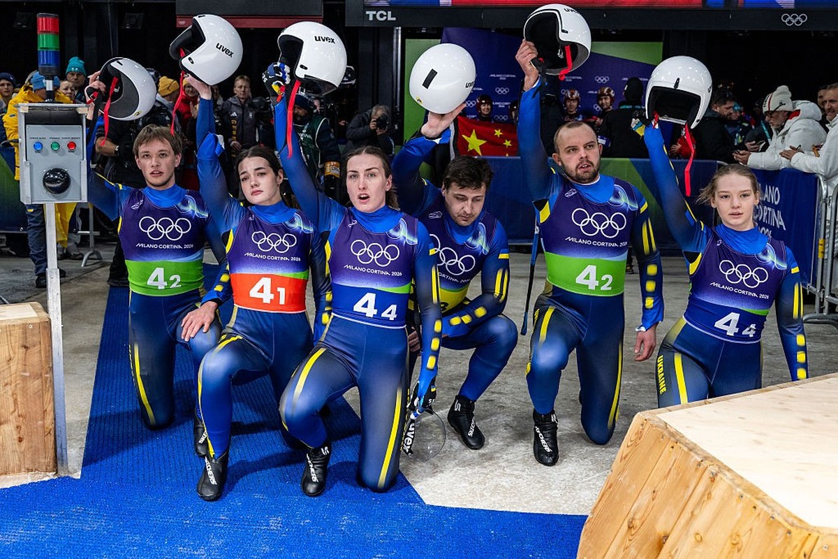 CORTINA D'AMPEZZO, ITALY - FEBRUARY 12: Ihor Hoi, Nazarii Kachmar, Yulianna Tunytska, Olena Stetskiv, Oleksandra Mokh and Andriy Mandziy of Team Ukraine reacts in the finish after the Luge Team R ...