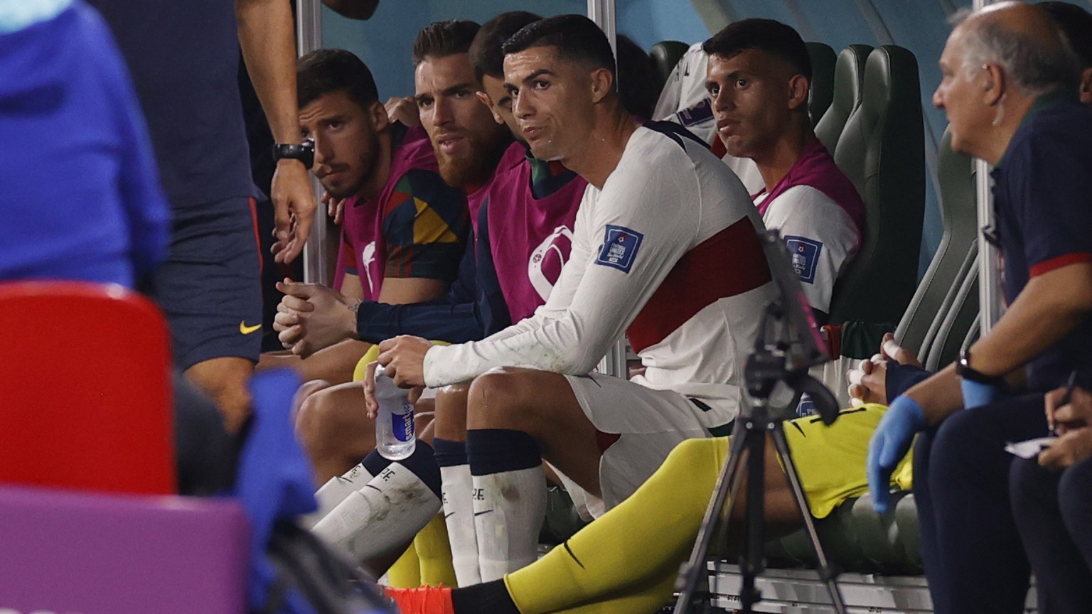 epa10344481 Cristiano Ronaldo of Portugal sits on the pitch after being substituted during the FIFA World Cup 2022 group H soccer match between South Korea and Portugal at Education City Stadium in Do ...