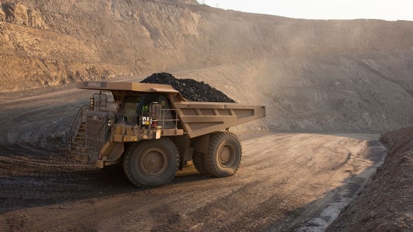 KOLWEZI, DRC- JULY 7: The sun sets on one of the open pit copper mines at Mutanda Mining Sarl on July 6, 2016 in Kolwezi, DRC. The mine is owned (69%) by Glencore, an Anglo-Swiss multinational commodi ...