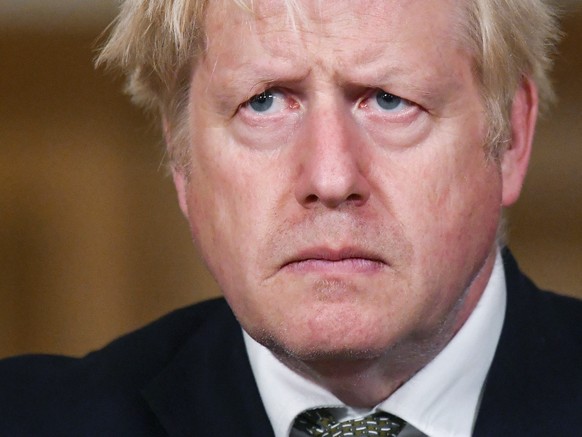 FILE - Britain&#039;s Prime Minister Boris Johnson looks on during a coronavirus briefing in Downing Street, London, Monday, Oct. 12, 2020. (Toby Melville/Pool Photo via AP, File)