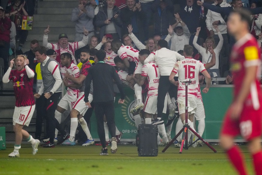 Leipzig&#039;s Christopher Nkunku, third from left, celebrates with his teammates after he scored his side&#039;s first goal during the German Soccer Cup final match between SC Freiburg and RB Leipzig ...