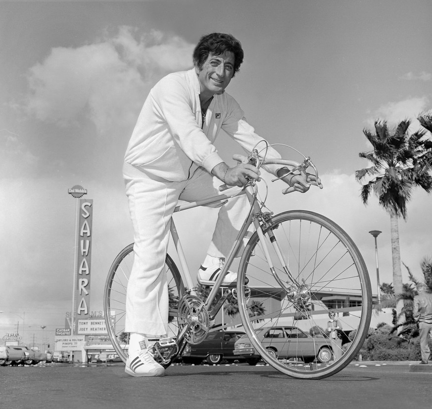 epa10760198 (FILE) - A handout photo made available by the Las Vegas News Bureau shows US singer Tony Bennett on a bicycle in front of the Sahara Hotel in Las Vegas, Nevada, USA, 02 March 1977 (reissu ...