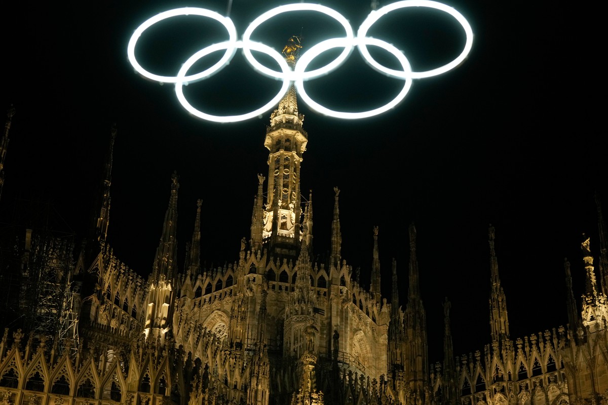 Neon Olympic rings hang next to the Duomo gothic cathedral for the upcoming Milan-Cortina Winter Olympics in Milan, Italy, Saturday, Dec. 27, 2025. (AP Photo/Luca Bruno)
Italy Milan-Cortina Winter Oly ...