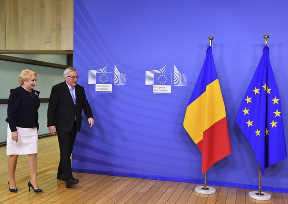 European Commission President Jean-Claude Juncker, right, walks with Romanian Prime Minister Viorica Dancila prior to a meeting at EU headquarters in Brussels, Wednesday Dec. 5, 2018. Romania will ass ...