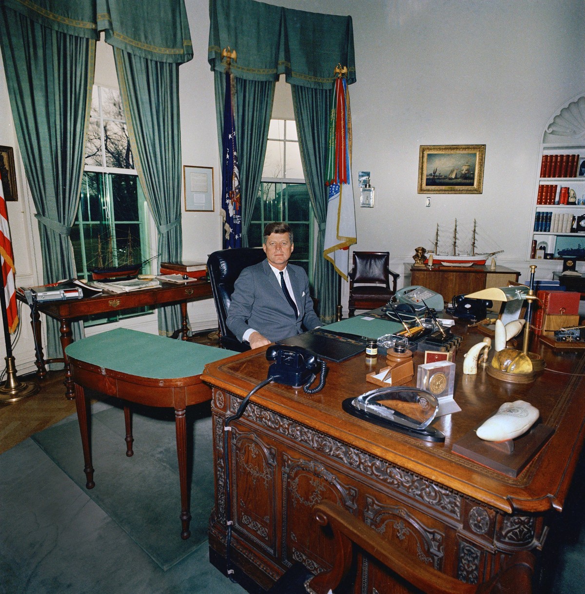 October 10, 2024, Washington, Dc, USA: U.S. President John F. Kennedy sitting at his desk HMS Resolute Desk, Oval Office, White House, Washington, D.C., USA, Cecil Stoughton, White House Photographs,  ...