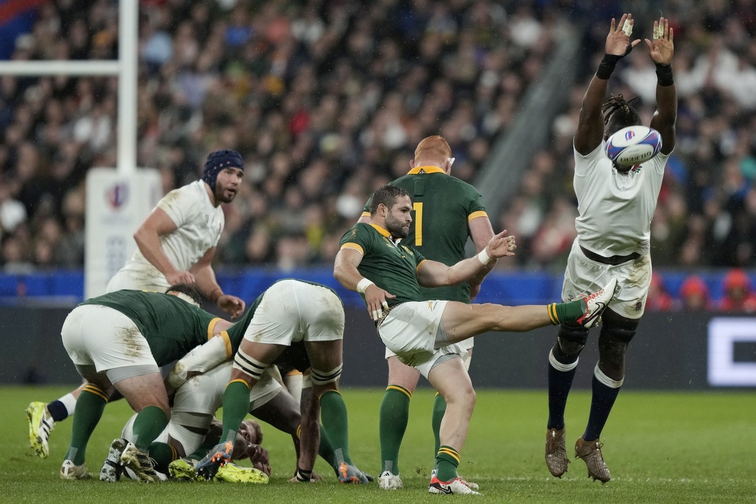 South Africa's Cobus Reinach kicks the ball during the Rugby World Cup semifinal match between England and South Africa at the Stade de France in Saint-Denis, outside Paris, Saturday, Oct. 21, 20 ...
