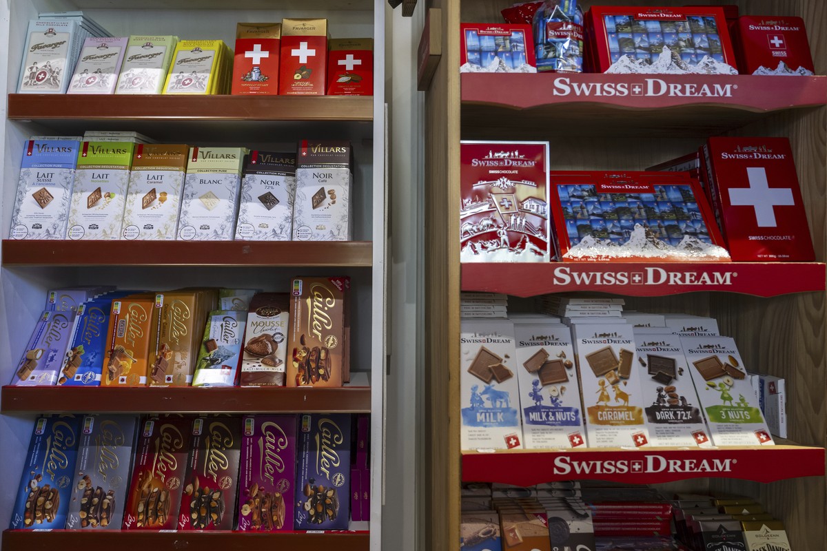 FILE - Swiss chocolate bars from the brands Favarger, Villars, Cailler and Swiss-Dream are photographed in a souvenir shop window on Thursday, April 10, 2025, in Geneva. (Martial Trezzini/Keystone via ...