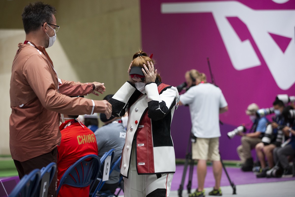 Nina Christen of Switzerland reacts after winning the bronze medal during the women's shooting 10m air rifle final at the 2020 Tokyo Summer Olympics in Tokyo, Japan, on Saturday, July 24, 2021. ( ...