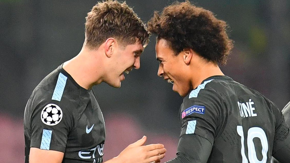 epa06302631 Manchester City's John Stones (L) celebrates with his teammate Leroy Sane (R) after scoring the 2-1 lead during the UEFA Champions League group F soccer match between SSC Napoli and M ...