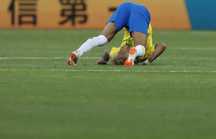 Brazil's Neymar falls down during the group E match between Brazil and Switzerland at the 2018 soccer World Cup in the Rostov Arena in Rostov-on-Don, Russia, Sunday, June 17, 2018. (AP Photo/Dark ...