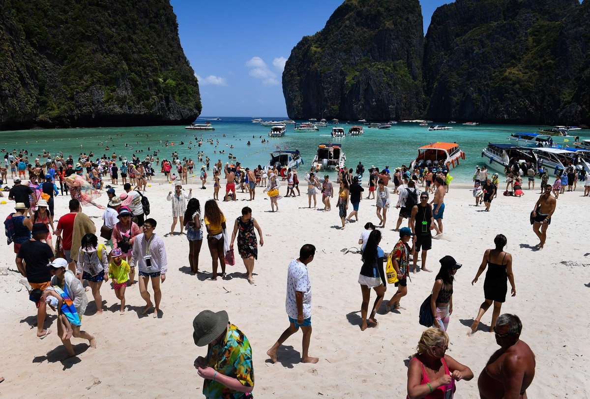 This photo taken on April 9, 2018 shows a crowd of tourists on the Maya Bay beach, on the southern Thai island of Koh Phi Phi. 
Across the region, Southeast Asia's once-pristine beaches are reeli ...